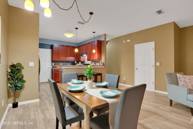 dining space featuring light hardwood / wood-style flooring