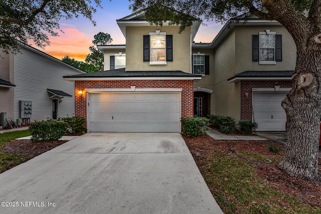 front of property with a garage