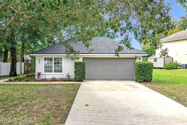 view of front of house with a shed and a front lawn