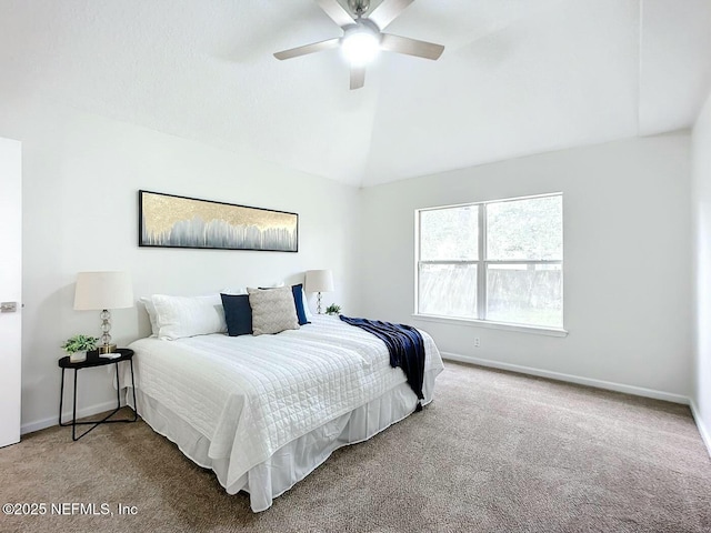 carpeted bedroom featuring lofted ceiling and ceiling fan