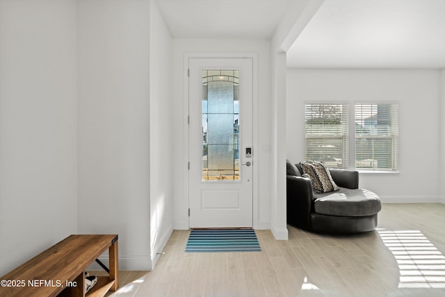 foyer with light hardwood / wood-style floors