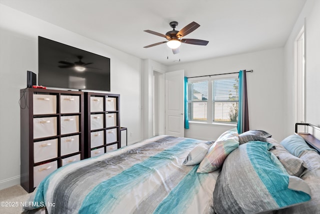 bedroom featuring ceiling fan and carpet