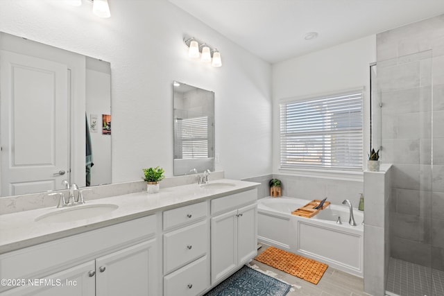 bathroom featuring vanity and plus walk in shower