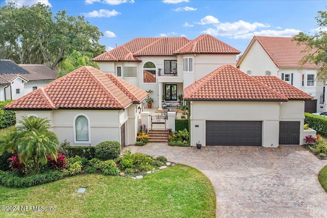 mediterranean / spanish house with a front lawn