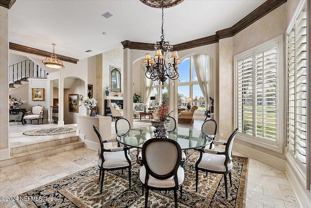 dining space with an inviting chandelier and ornamental molding