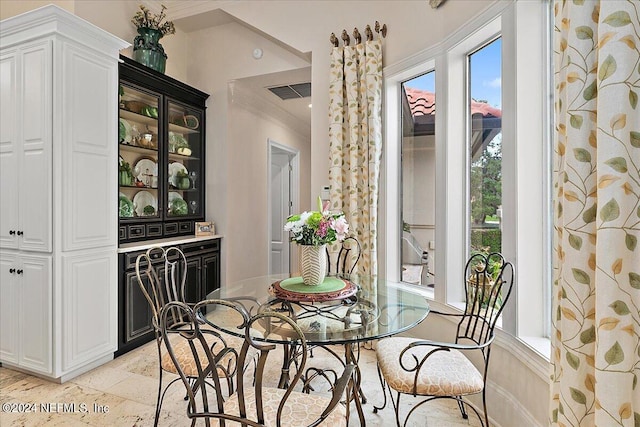 dining room with crown molding