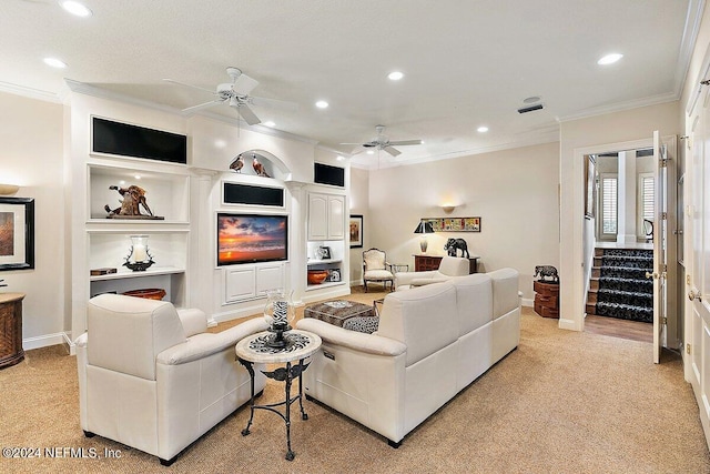 carpeted living room with crown molding, built in features, and ceiling fan