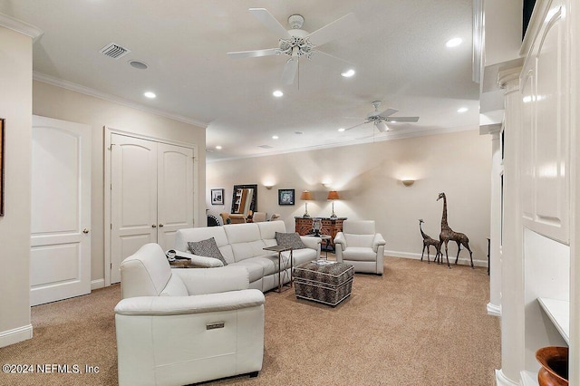 carpeted living room featuring ceiling fan and ornamental molding