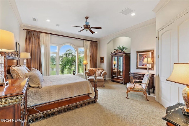 bedroom with ceiling fan, ornamental molding, and carpet flooring