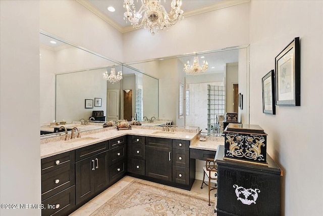 bathroom with an inviting chandelier, vanity, and crown molding