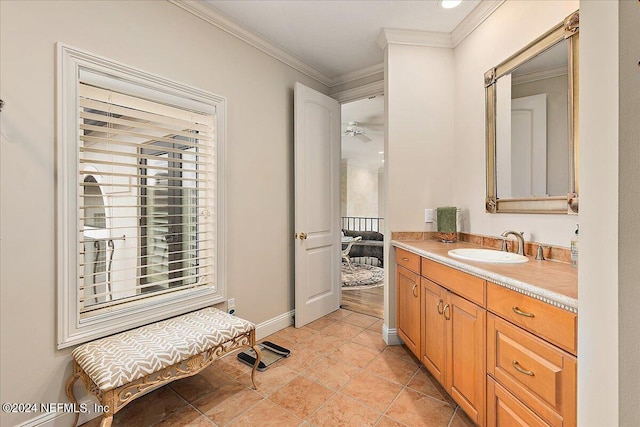 bathroom featuring ornamental molding and vanity