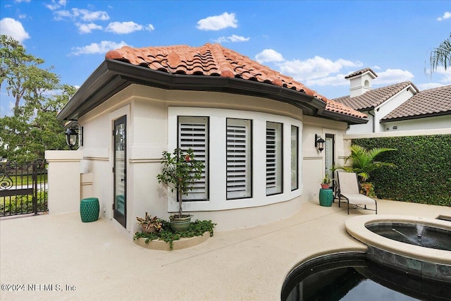 rear view of house featuring a patio area