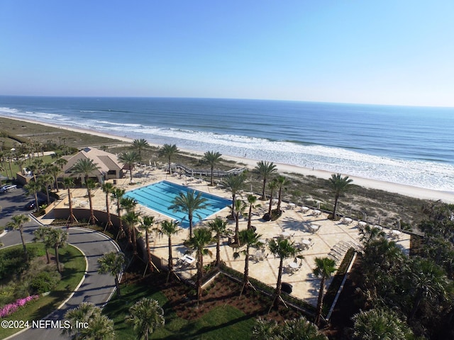 bird's eye view featuring a beach view and a water view