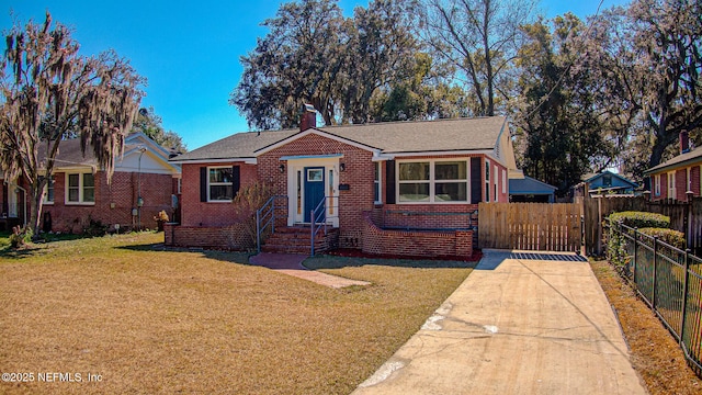 bungalow-style home with a front lawn