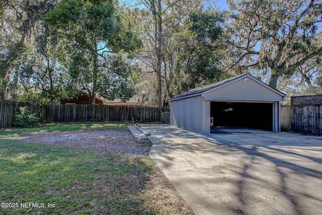 view of yard with a garage and an outdoor structure