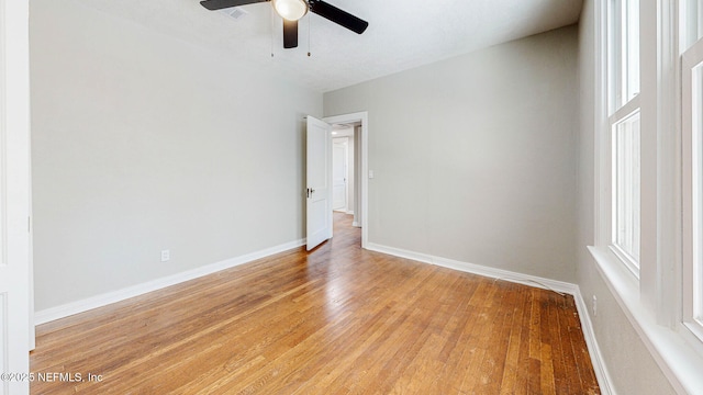 spare room featuring ceiling fan and light wood-type flooring