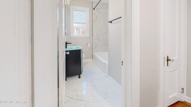 full bathroom featuring vanity, toilet, and tiled shower / bath combo