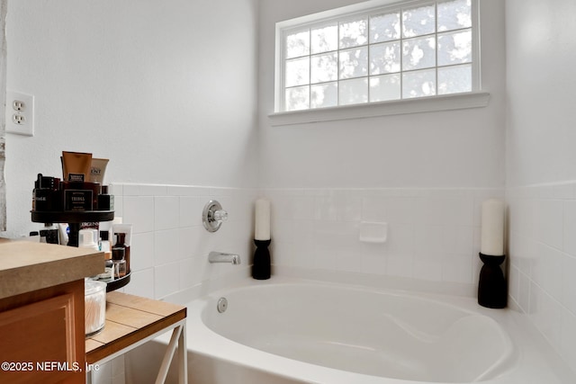 bathroom with vanity and a bathtub