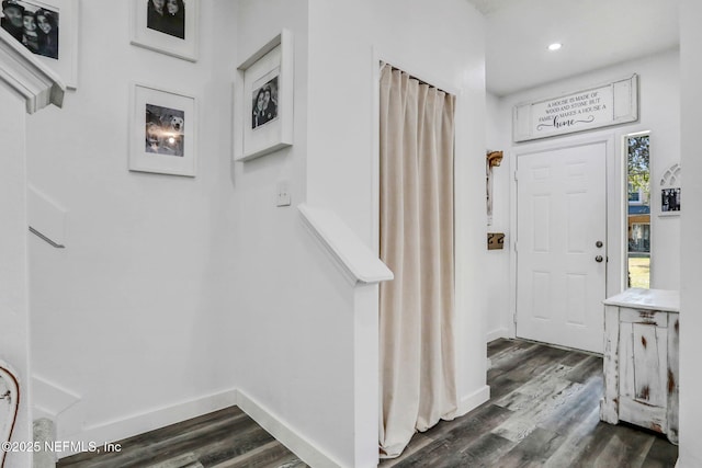 entrance foyer featuring dark hardwood / wood-style floors