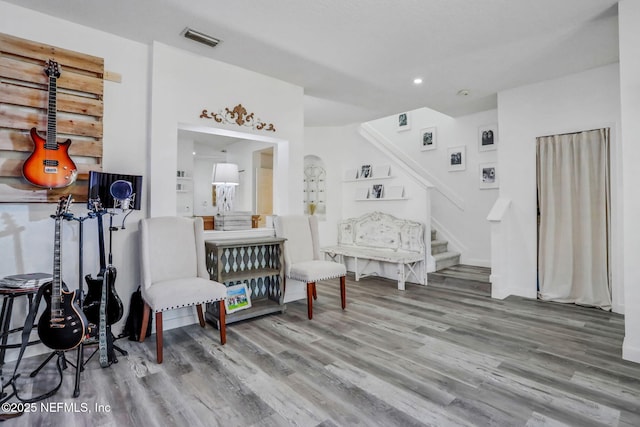 sitting room with hardwood / wood-style flooring