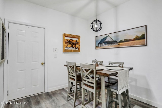 dining room with hardwood / wood-style floors