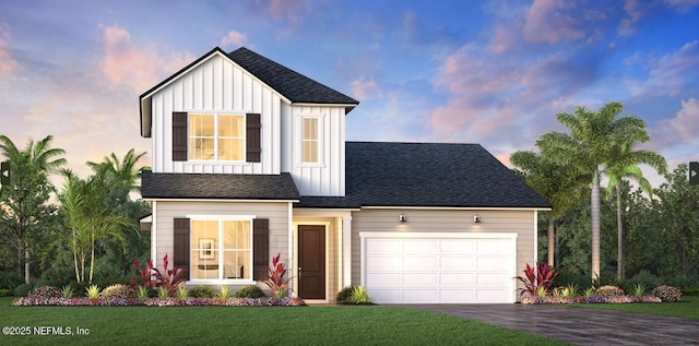 view of front facade featuring a garage and a lawn