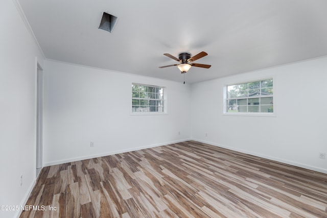 unfurnished room featuring crown molding, light hardwood / wood-style flooring, and ceiling fan