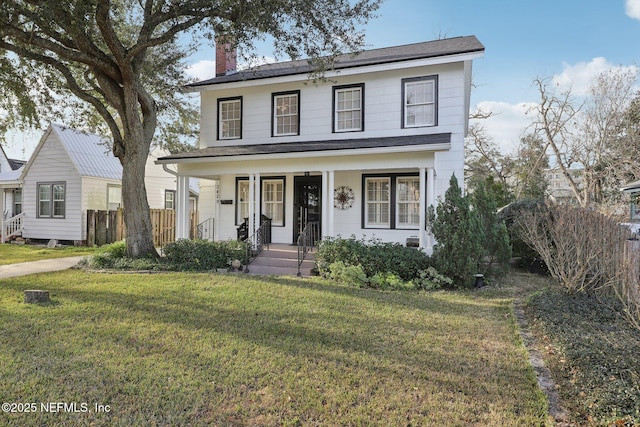 view of front of home with a porch and a front lawn