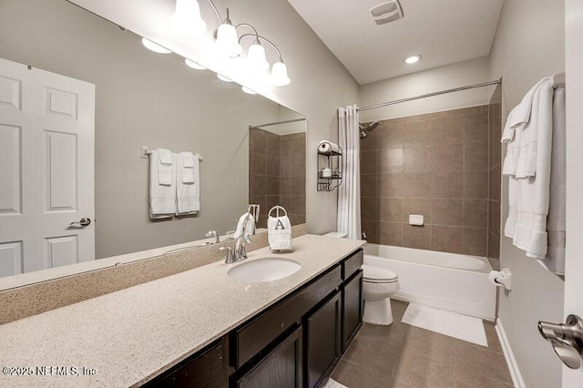 full bathroom featuring shower / tub combo with curtain, vanity, tile patterned flooring, and toilet