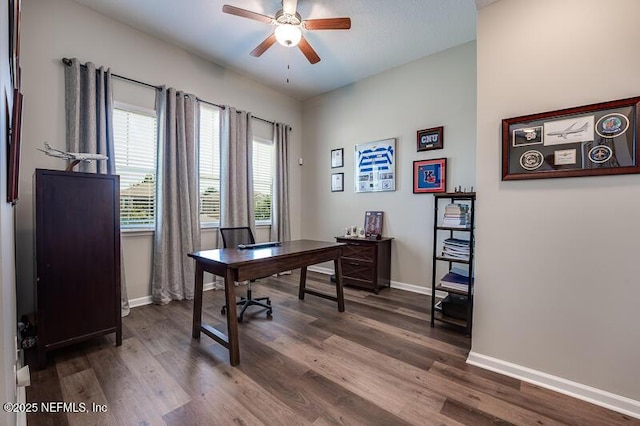 office with dark hardwood / wood-style flooring and ceiling fan