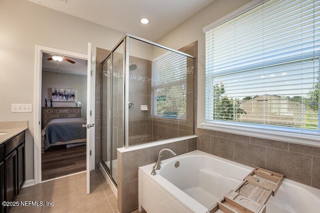 bathroom with vanity, tile patterned floors, and shower with separate bathtub