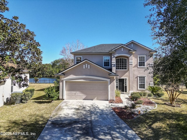 view of front property featuring a garage and a front lawn