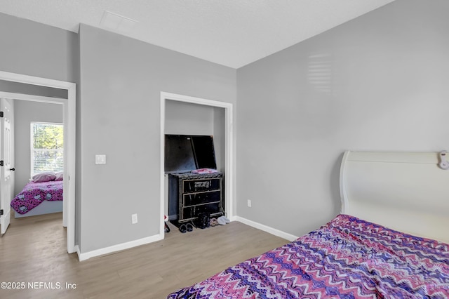 bedroom featuring hardwood / wood-style flooring