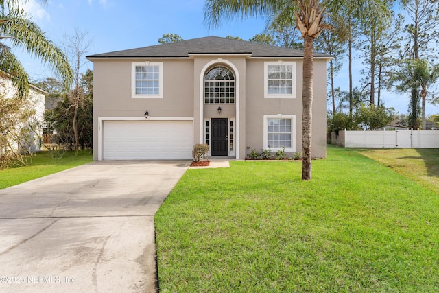 view of front facade with a garage and a front lawn