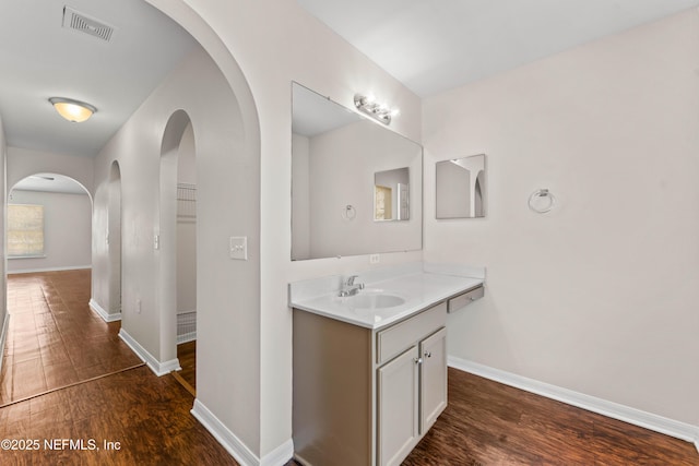 bathroom featuring hardwood / wood-style flooring and vanity