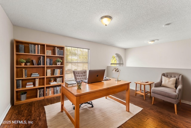 office area featuring dark hardwood / wood-style floors and a textured ceiling