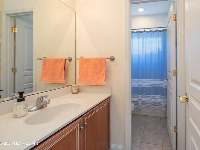 bathroom featuring vanity, tile patterned floors, and walk in shower