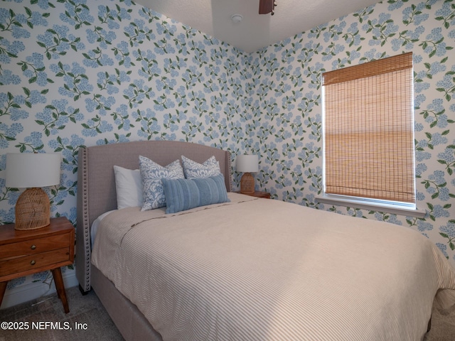 bedroom with ceiling fan and carpet