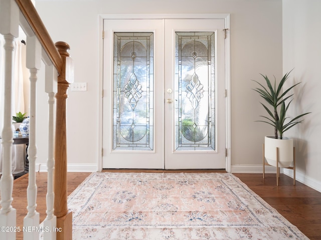 entrance foyer with hardwood / wood-style floors and french doors