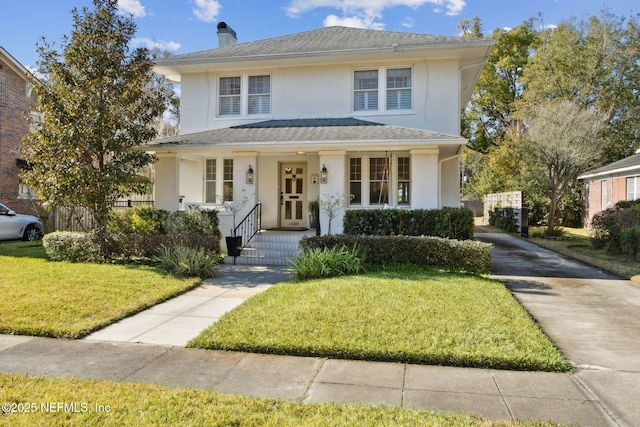 view of front property featuring a front yard and covered porch