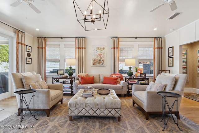 living room featuring ceiling fan and wood-type flooring