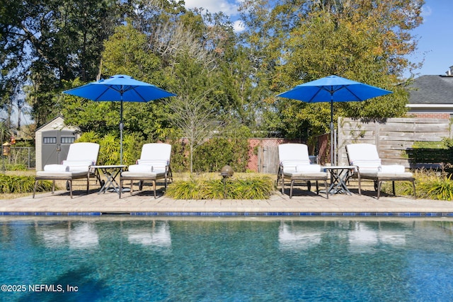 view of swimming pool featuring a patio