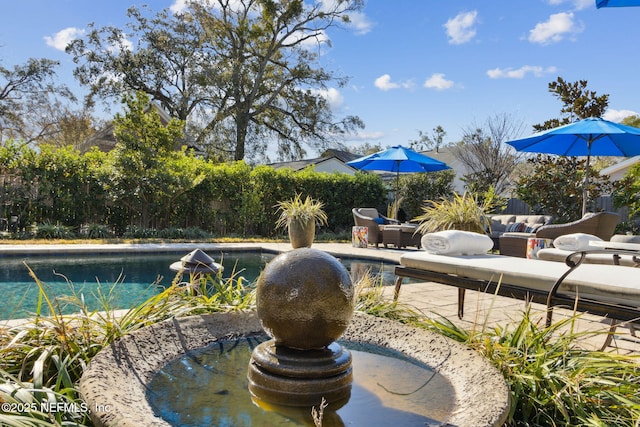 view of pool with an outdoor hangout area and a patio