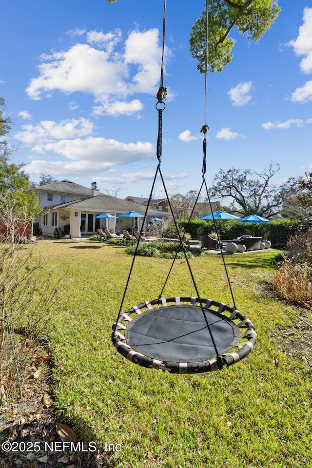 view of yard with a trampoline