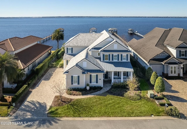 birds eye view of property featuring a water view