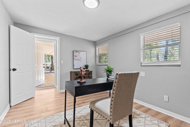 office area with light hardwood / wood-style flooring