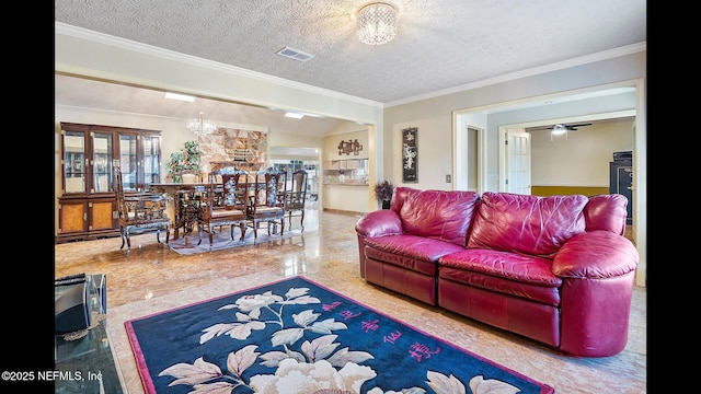 living room featuring ornamental molding and a textured ceiling