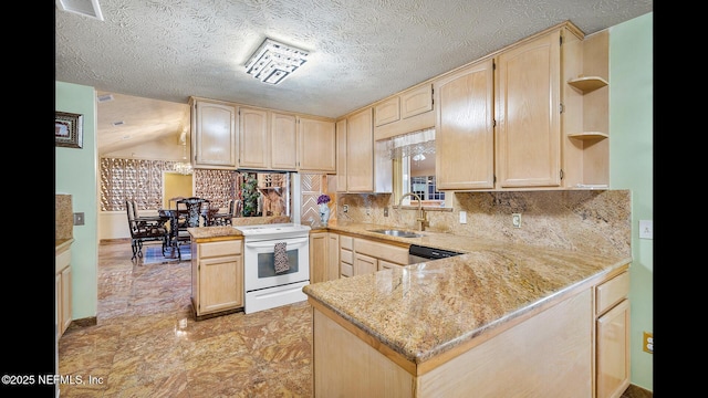 kitchen featuring sink, electric range, tasteful backsplash, light brown cabinetry, and kitchen peninsula