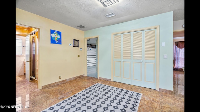 entrance foyer featuring a textured ceiling