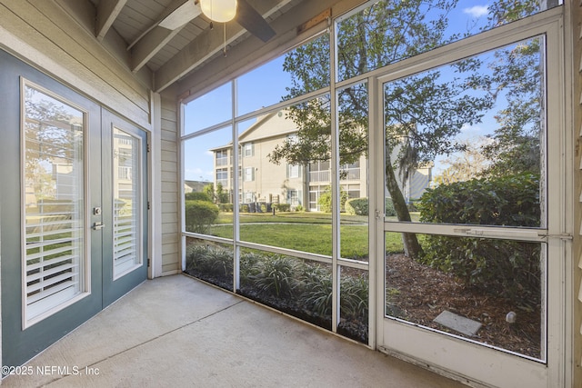 unfurnished sunroom with french doors